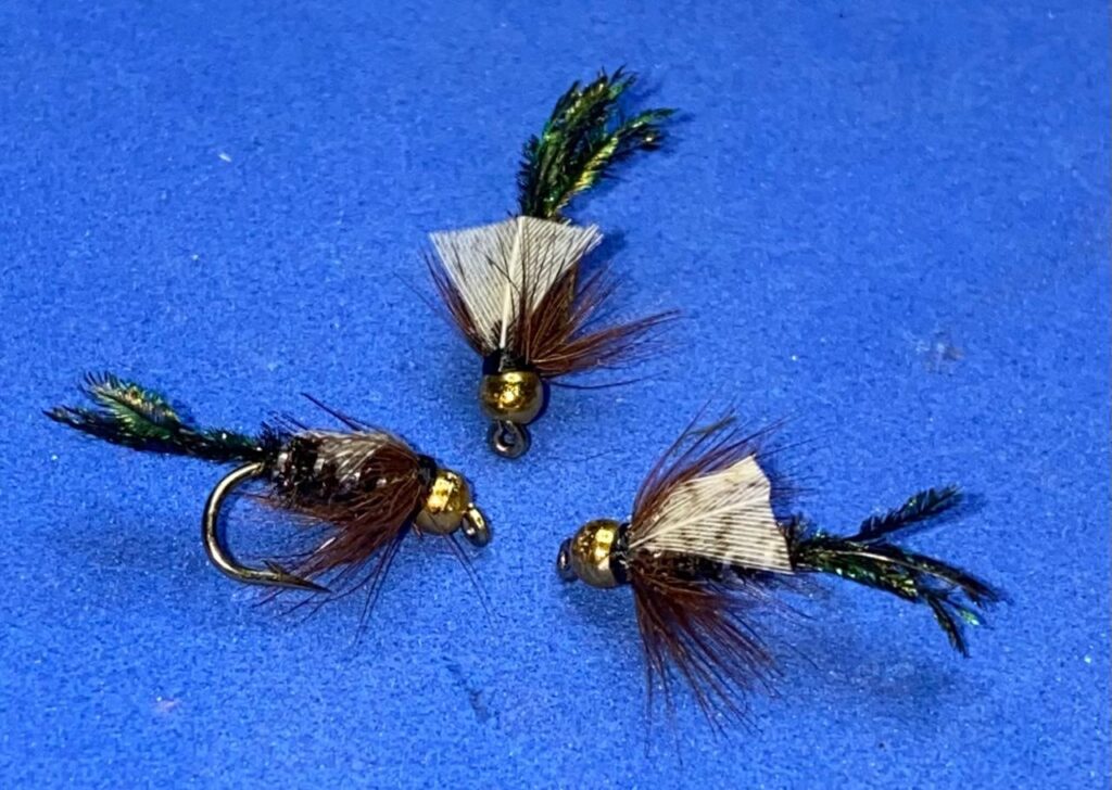 Three hand-tied beadhead Zug Bug nymphs showing bead size, hook and clear hook eye