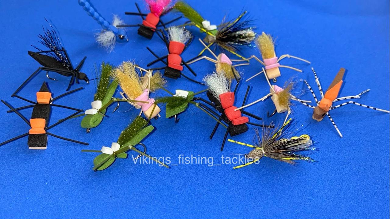 Hand-tied foam terrestrial flies including Chernobyl Ant, Chubby Chernobyl and Form Hopper patterns on a blue background