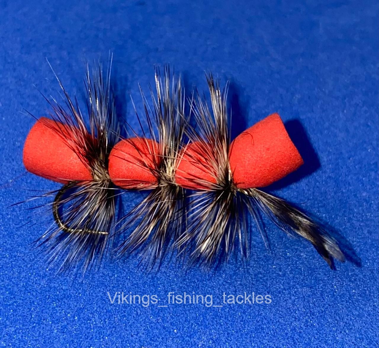 Three hand-tied Form Woolly Worm (red) flies with segmented red foam bodies and full-length palmered hackle